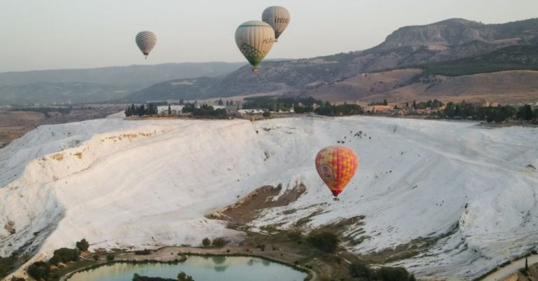 Hot Springs - Aerial View of Hot Air Baloons over Piknik Alani Park and Travertines in Pamukkale