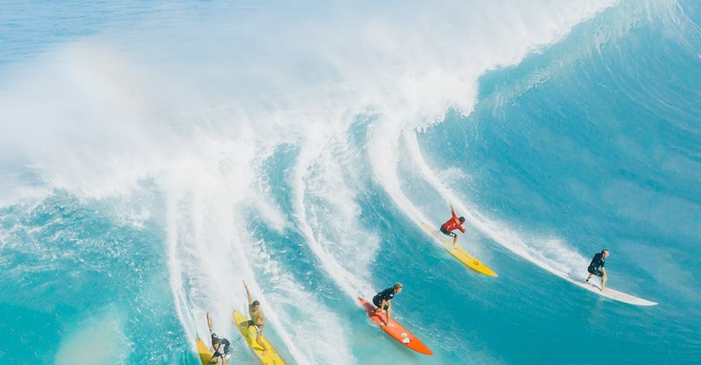 Surfing Beaches - People Surfing on Sea Waves