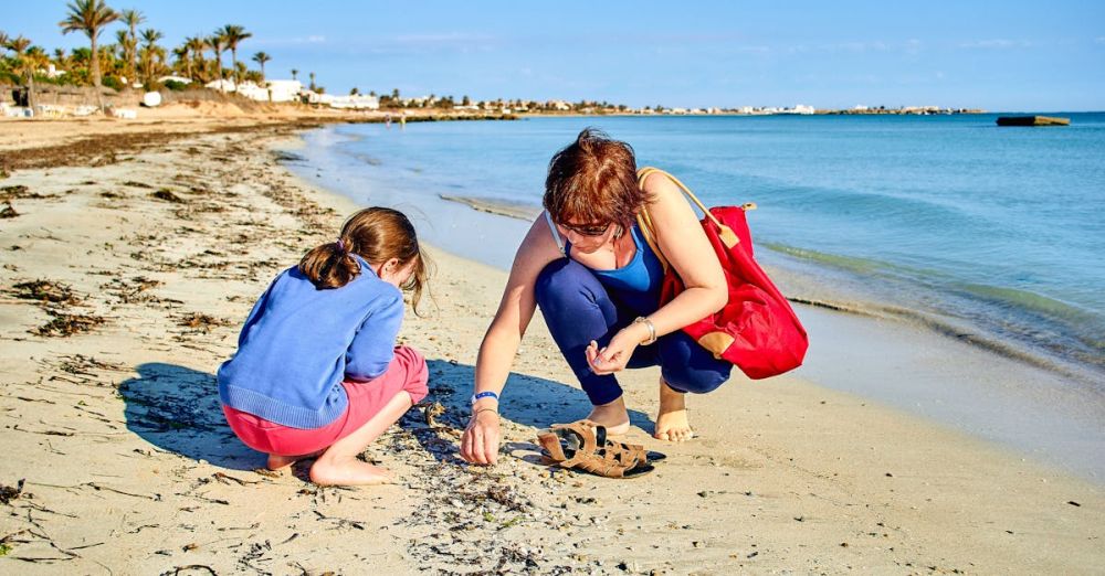 Shell Collecting - Daughter and Mother Collecting Shells on Beach