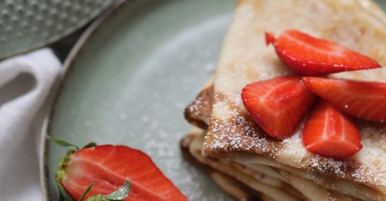 Hangi Meal - A plate with crepes and strawberries on it