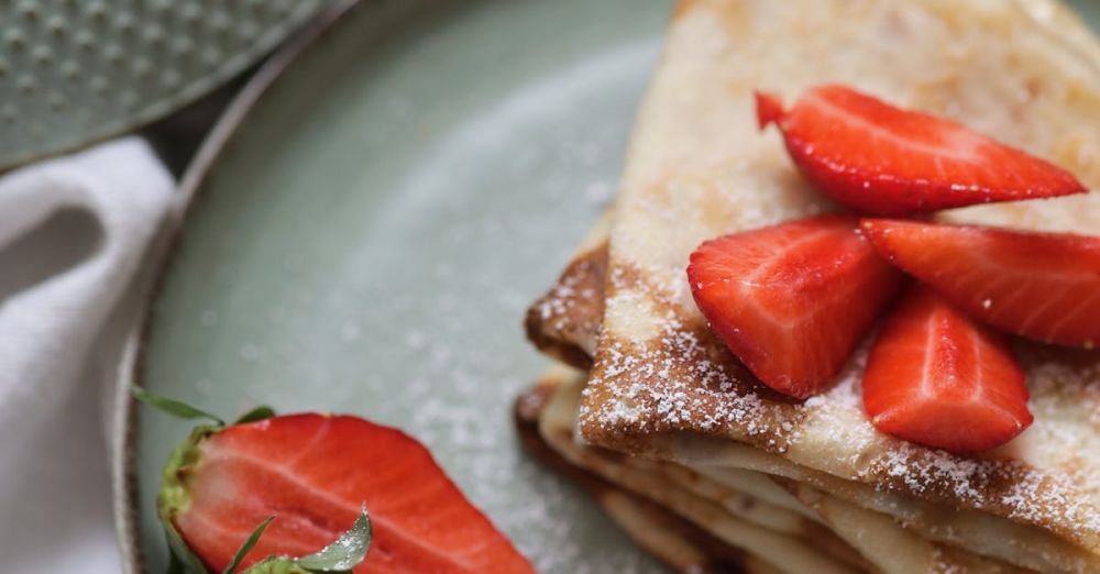 Hangi Meal - A plate with crepes and strawberries on it