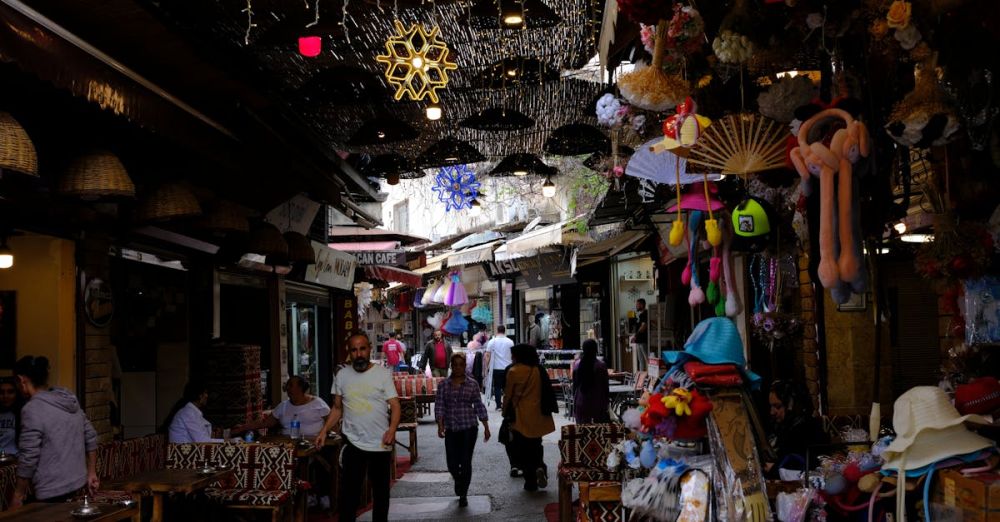 Cafes - A crowded market with many people walking around