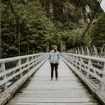 man-on-wooden-bridge-Milford Sound